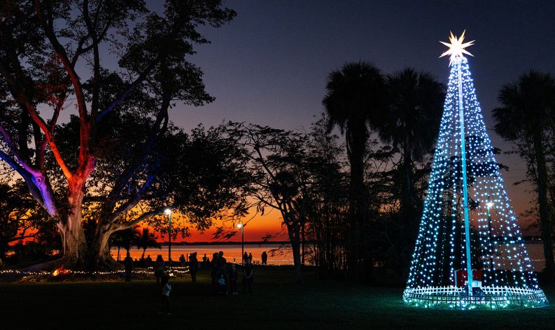 Visitors attend the Children's Christmas Tree Trail event at the Edison & Ford Winter Estates on Monday, Nov. 25, 2024. Holiday Nights at the Edison & Ford Winter Estates began Nov. 29, 2024. The event was highlighted Christmas trees decorated by area students.