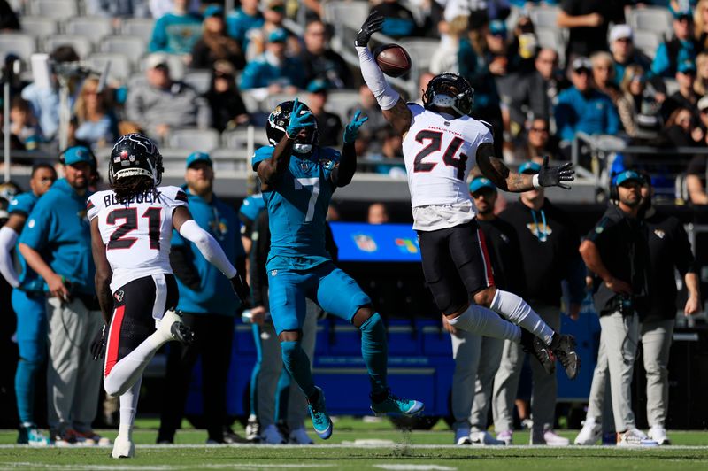 Houston Texans cornerback Derek Stingley Jr. (24) breaks up a pass intended for Jacksonville Jaguars wide receiver Brian Thomas Jr. (7) during the first quarter of an NFL football matchup Sunday, Dec. 1, 2024 at EverBank Stadium in Jacksonville, Fla. [Corey Perrine/Florida Times-Union]