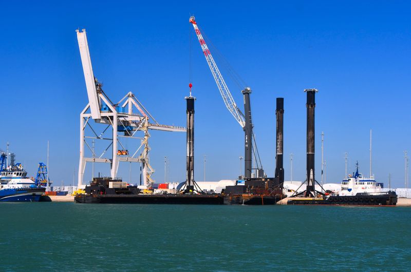 In a rare sight, three SpaceX first-stage rocket boosters await offloading in December 2024 at Port Canaveral.