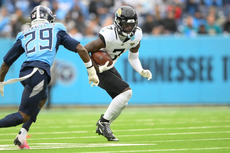 Dec 8, 2024; Nashville, Tennessee, USA; Jacksonville Jaguars wide receiver Brian Thomas Jr. (7) runs the ball after a made catch against the Tennessee Titans during the second half at Nissan Stadium. Mandatory Credit: Steve Roberts-Imagn Images