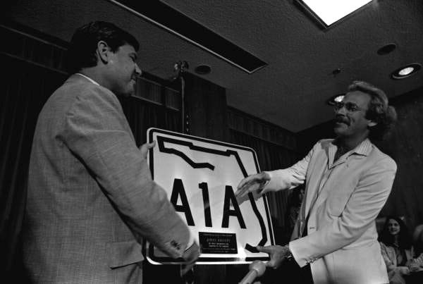 Florida Gov. Bob Graham presenting an A1A sign to Jimmy Buffett, circa 1980.
