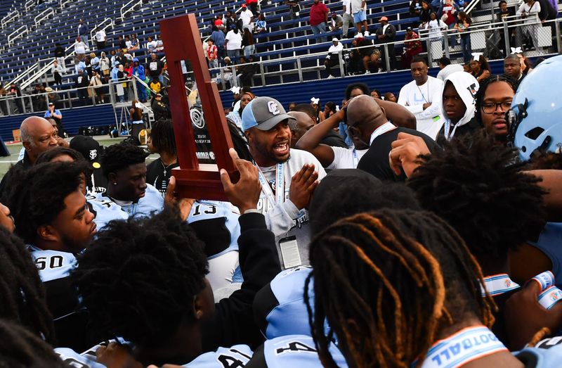 Gadsden County football head coach Russell Ellington talks with his players after their 38-27 loss to Cocoa in the FHSAA football Class 2A state championship Thursday, December 12, 2024. Craig Bailey/FLORIDA TODAY via USA TODAY NETWORK