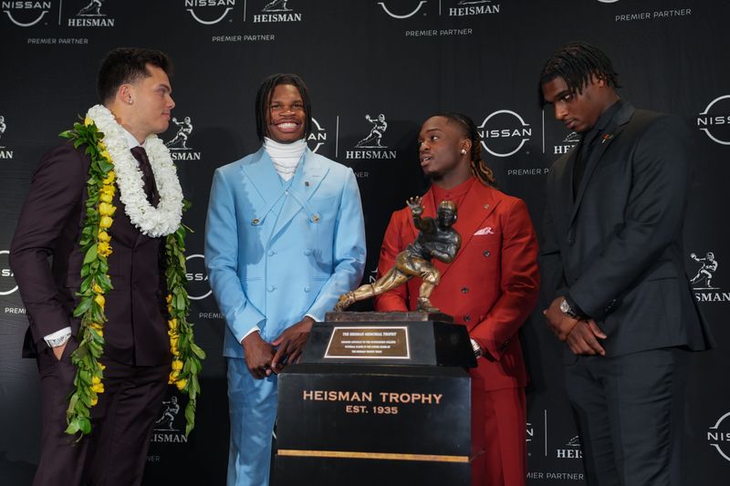 Heisman Trophy nominees Dillon Gabriel, Travis Hunter, Ashton Jeanty and Cam Ward pose for a photo in New York on Dec. 14, 2024. Hunter, a receiver and cornerback from Colorado, won the 2024 Heisman Trophy.