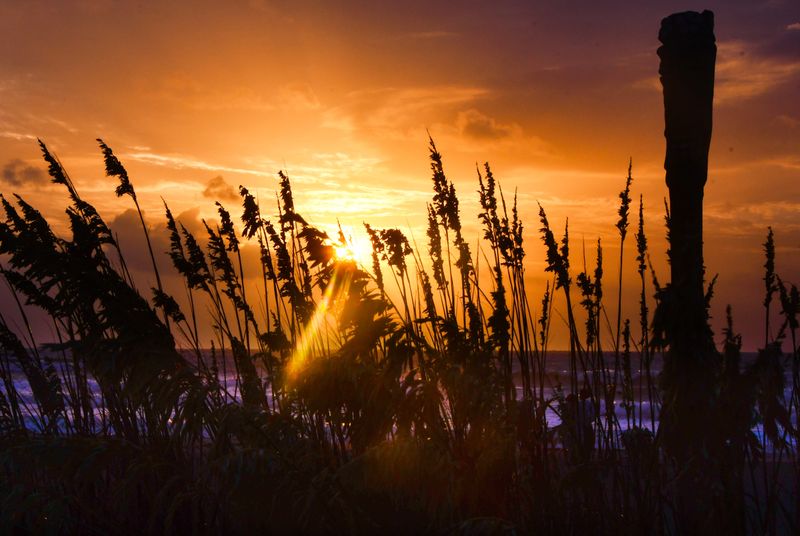 It was not your calm, meditative sunrise for the summer solstice, the longest day of the year. With sunrise almost coinciding with high tide, there were rough seas, marine and riptide warnings and strong northeast winds making the beach a challenging morning walk.