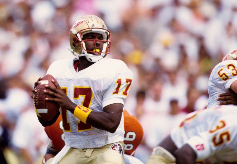 Oct 3, 1992; Miami, FL, USA: FILE PHOTO; Florida State Seminoles quarterback Charlie Ward (17) looks to throw against Miami at the Orange Bowl. Miami defeated FSU 19-16. Mandatory Credit: USA TODAY Sports