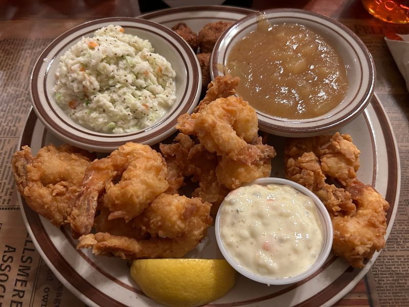 Fried shrimp dinner with coleslaw and apple sauce at Marsh Landing Restaurant.
