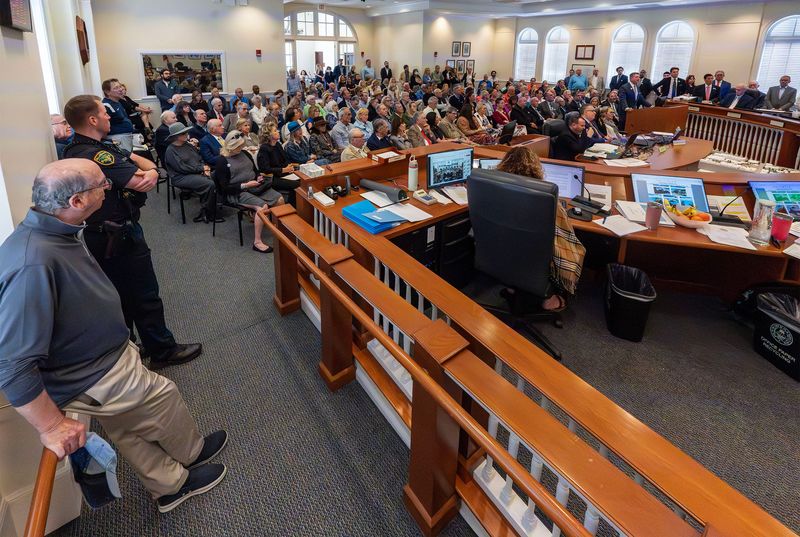 A standing room only crowd fills Palm Beach Town Hall on Jan. 15 as council members take a second look at a redevelopment project proposed by Palm Beach Synagogue.