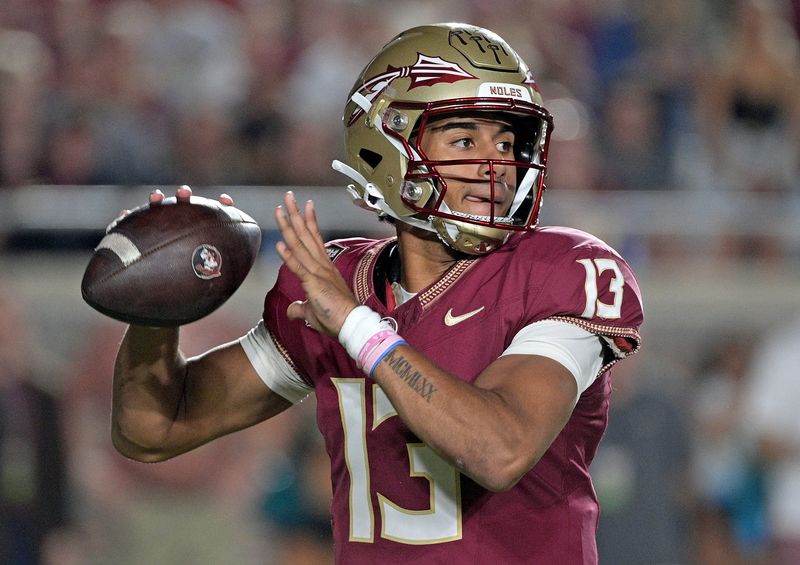 Oct 21, 2023; Tallahassee, Florida, USA; Florida State Seminoles quarterback Jordan Travis (13) looks to throw during the first half against the Duke Blue Devils at Doak S. Campbell Stadium. Mandatory Credit:
 Melina Myers-USA TODAY Sports