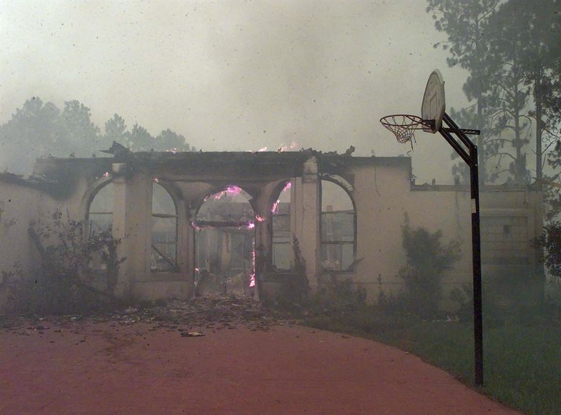A home north of Florida 100 in Palm Coast burns after being engulfed by a fast-moving wildfire in 1998. At least 40 homes were destroyed in Flager County in the previous two days.