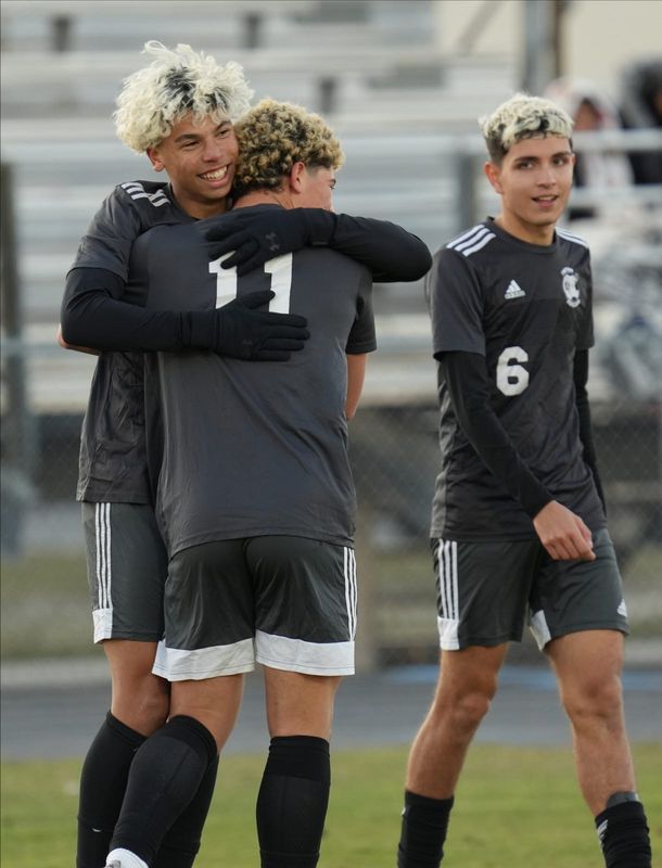 Mariner player Alessandro Gonzalez is congratulated by teammate Justin Medero (11) after scoring a goal. The Mariner High School boys soccer team hosted North Fort Myers in a district semifinal match Friday, Jan. 24, 2025. With this victory Mariner coach Martin Cardenas achieved his 500th win leading Mariner. The team won with a final score of 8-0.