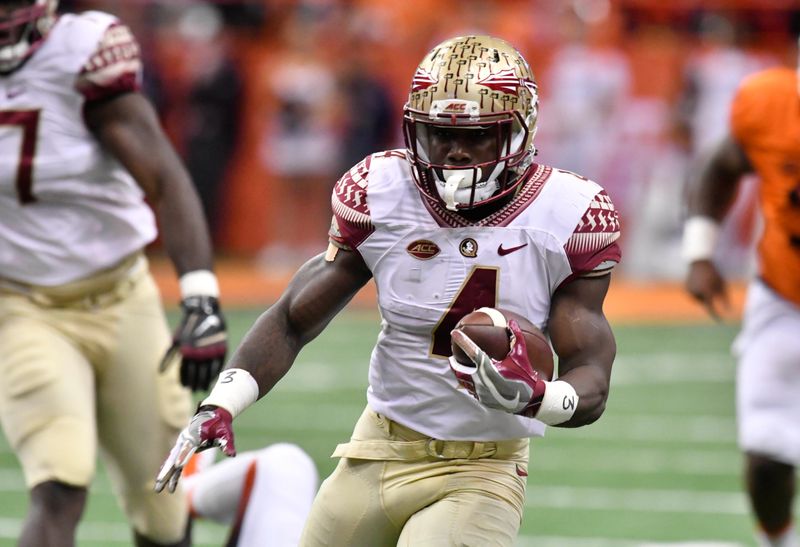 Nov 19, 2016; Syracuse, NY, USA; Florida State Seminoles running back Dalvin Cook (4) carries the ball during the first quarter of a game against the Syracuse Orange at the Carrier Dome. Mandatory Credit: 
Mark Konezny-USA TODAY Sports