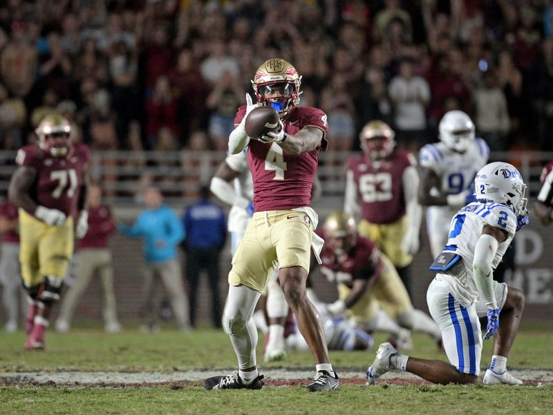 Oct 21, 2023; Tallahassee, Florida, USA; Florida State Seminoles wide receiver Keon Coleman (4) celebrates after a first down catch during the second half against the Duke Blue Devils at Doak S. Campbell Stadium. Mandatory Credit: 
Melina Myers-USA TODAY Sports