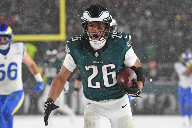Philadelphia Eagles running back Saquon Barkley (26) runs for on a 78-yard touchdown run against the Los Angeles Rams during the fourth quarter in a 2025 NFC divisional round game at Lincoln Financial Field on Jan 19, 2025, in Philadelphia.
