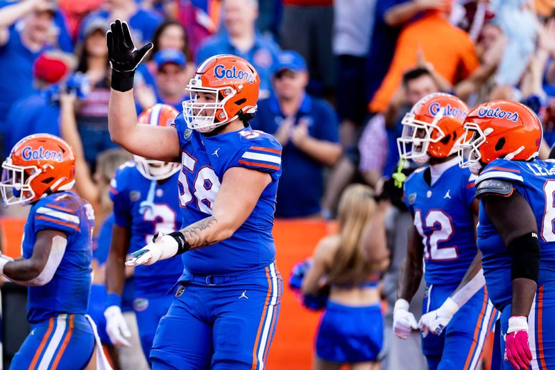 Florida Gators offensive lineman Austin Barber (58) celebrates after a touchdown during the first half against the South Carolina Gamecocks at Steve Spurrier Field at Ben Hill Griffin Stadium in Gainesville, FL on Saturday, November 12, 2022. [Matt Pendleton/Gainesville Sun]

Ncaa Football Florida Gators Vs South Carolina Gamecocks

Syndication Gainesville Sun