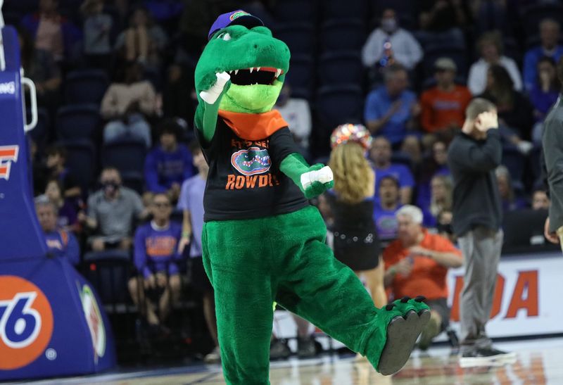At a break in the action, University of Florida mascot Albert gets ready to throw T-shirts to fans as the Gators play a basketball game against the University of North Florida at Exactech Arena in Gainesville Fla. Dec. 8, 2021. The Gators beat the UNF Ospreys to break their two-game losing streak.Flgai 120821 Ufvs Unf Bball 23