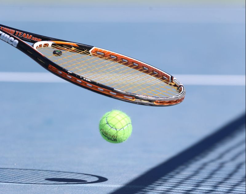 Oct 15, 2016; Surprise, AZ, USA; Camile Gbaguidi (Savannah College of Art & Design) uses her racked to pickup a ball during her Division II match against Madeline Hill (Washburn) at the ITA Oracle Cup at Surprise Tennis & Racquet Complex. Mandatory Credit: Allan Henry-USA TODAY Sports