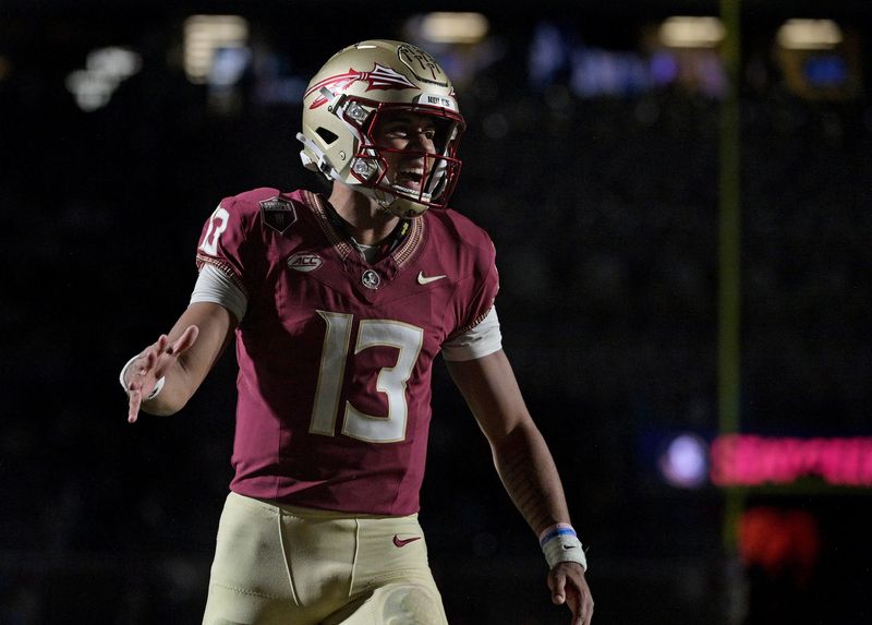 Oct 21, 2023; Tallahassee, Florida, USA; Florida State Seminoles quarterback Jordan Travis (13) celebrates a touchdown against the Duke Blue Devils during the second half at Doak S. Campbell Stadium. Mandatory Credit: Melina Myers-USA TODAY Sports