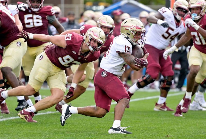 Apr 20, 2024; Tallahassee, Florida, USA; Florida State Seminoles running back Jaylin Lucas (13) runs with the ball during the Spring Showcase at Doak S. Campbell Stadium. Mandatory Credit: 
Melina Myers-USA TODAY Sports
