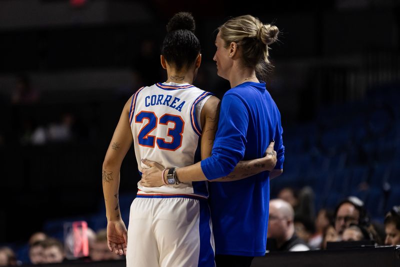 Florida Gators guard Leilani Correa (23) and Florida Gators head coach Kelly Rae Finley embrace against the St. John's Red Storm during the second half at Billy Donovan Court at Stephen C. O'Connell Center in Gainesville, FL on Thursday, March 21, 2024. [Matt Pendleton/Gainesville Sun]
