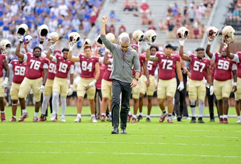 Sep 14, 2024; Tallahassee, Florida, USA; Florida State Seminoles head coach Mike Norvell leads his team before a game against the Memphis Tigers at Doak S. Campbell Stadium. Mandatory Credit: 
Melina Myers-Imagn Images
