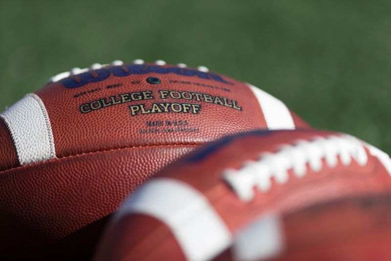Sep 30, 2017; Madison, WI, USA; Footballs with the college football playoff logo sit on the field during warmups prior to the game between the Northwestern Wildcats and Wisconsin Badgers at Camp Randall Stadium. Mandatory Credit: Jeff Hanisch-USA TODAY Sports