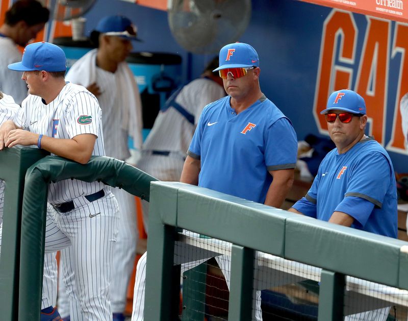 University of Florida head coach Kevin O'Sullivan, center, watches after a inning ending strikeout as the Gators play the University of South Florida during the Gainesville Regional of the 2021 Division 1 Baseball Championship, at Florida Ballpark on the University of Florida campus in Gainesville Fla. June 4, 2021.UFbaseballVs.USFReg05