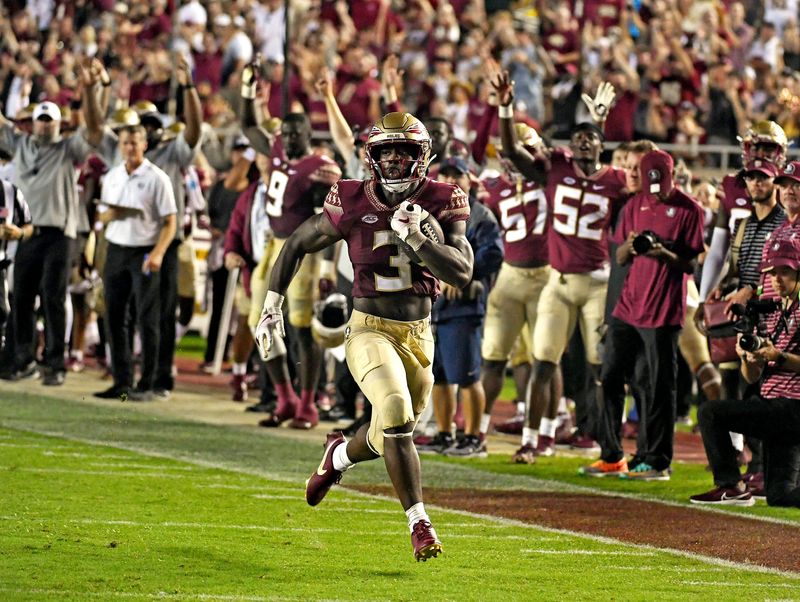 Aug 27, 2022; Tallahassee, Florida, USA; Florida State Seminoles running back Trey Benson (3) scores a touchdown against the Duquesne Dukes during the second half at Doak S. Campbell Stadium. Mandatory Credit: Melina Myers-USA TODAY Sports