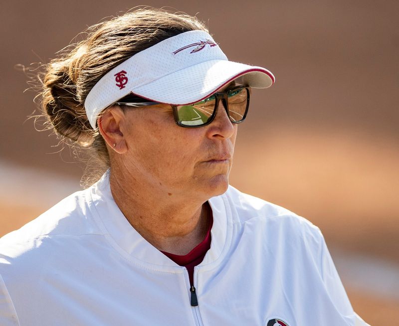 Florida State head coach Lonni Alameda walks to first base with the field reflecting in her sunglasses. Florida State defeated Kennesaw State 6-2 in the first round of the Tallahassee Regionals Friday, May 21, 2021.
© Alicia Devine/Tallahassee Democrat