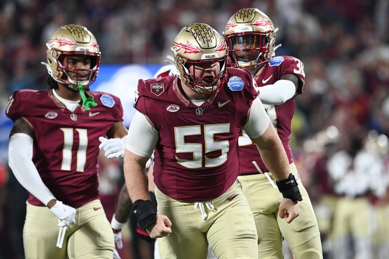 Dec 2, 2023; Charlotte, NC, USA; Florida State Seminoles defensive lineman Braden Fiske (55) reacts after a tackle on Louisville Cardinals running back Jawhar Jordan (25) in the first quarter at Bank of America Stadium. Mandatory Credit: 
Bob Donnan-USA TODAY Sports