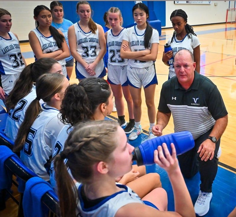 Lakeland Christian head girls basketball coach Mike Carl, pictured here on the right, has coached up his team the most successful year since 2007-8.