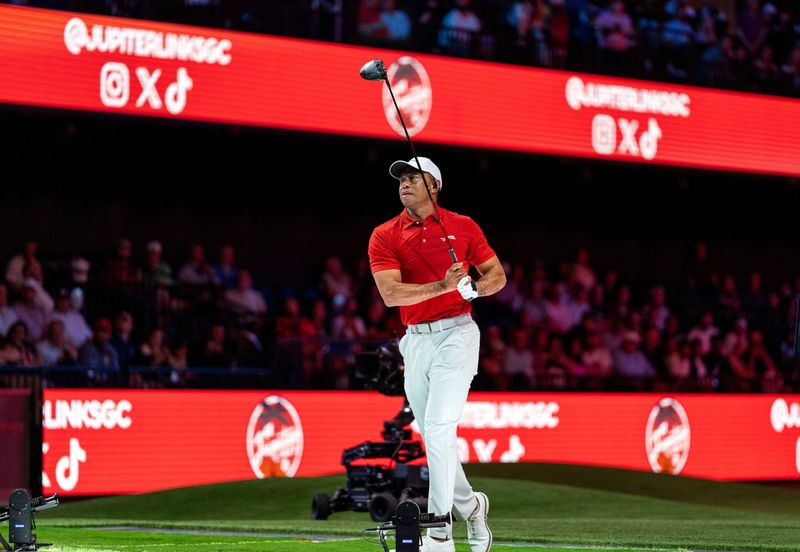 Tiger Woods of Jupiter Links GC tees off against New York Golf Club during a TGL match at SoFi Center at Palm Beach State College on February 18, 2025, in Palm Beach Gardens, Florida.