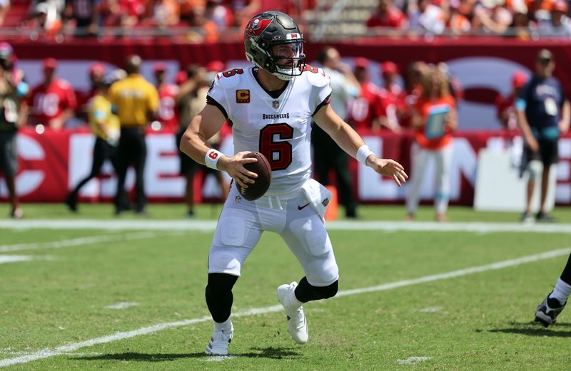 Sep 22, 2024; Tampa, Florida, USA; Tampa Bay Buccaneers quarterback Baker Mayfield (6) drops back during the first quarter against the Denver Broncos at Raymond James Stadium. Mandatory Credit: Kim Klement Neitzel-Imagn Images