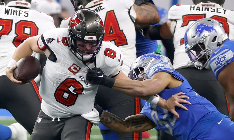 Jan 21, 2024; Detroit, Michigan, USA; Detroit Lions safety Brian Branch sacks Tampa Bay Buccaneers quarterback Baker Mayfield during the first half against the Tampa Bay Buccaneers in a 2024 NFC divisional round game at Ford Field. Mandatory Credit: Eric Seals-USA TODAY Sports