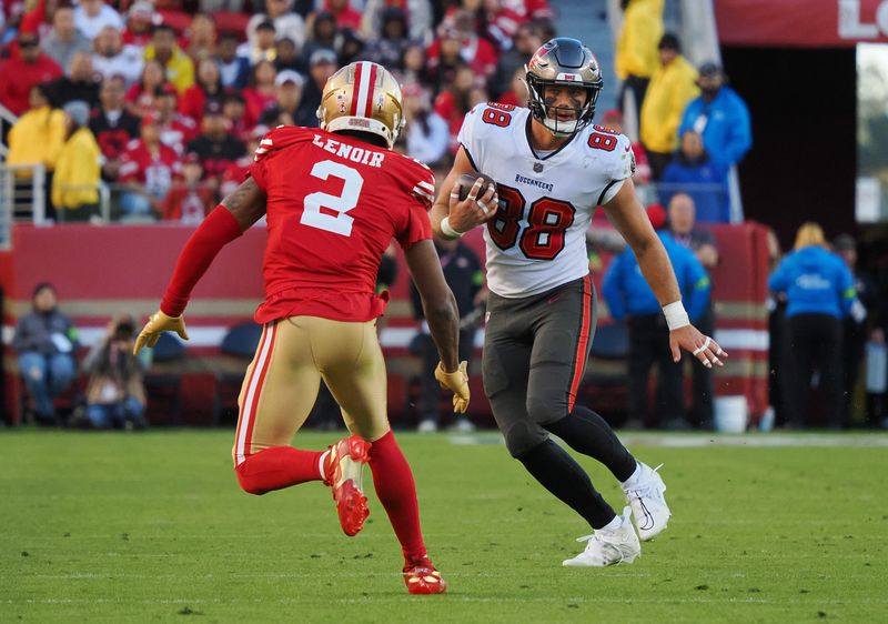 Nov 19, 2023; Santa Clara, California, USA; Tampa Bay Buccaneers tight end Cade Otton (88) carries the ball against San Francisco 49ers wide receiver Isaiah Winstead (2) during the fourth quarter at Levi's Stadium. Mandatory Credit: Kelley L Cox-USA TODAY Sports
