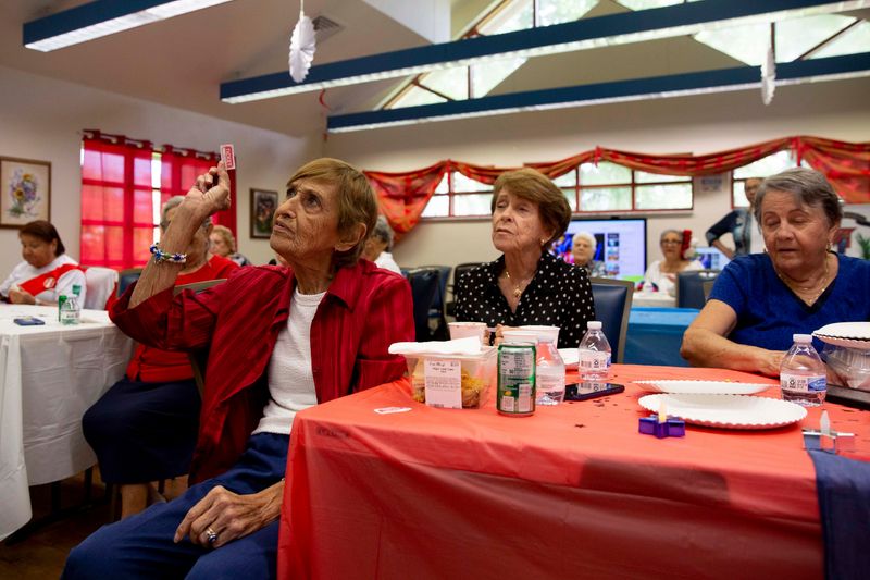 Lilia García grabs a raffle ticket during a special event, Wednesday, Aug. 31, 2022, at the Collier County Senior Center-Golden Gate in Naples, Fla,The center will $1 million in state funding to remodel and add space to offer more activities to seniors to stay engaged and active.