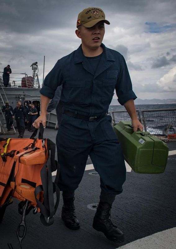 Operations Specialist Seaman Raymond Zumba prepares to provide treatment to sailors during a 2018 medical training exercise on the destroyer USS Carney.