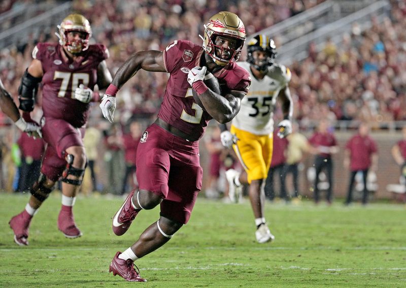 Sep 9, 2023; Tallahassee, Florida, USA; Florida State Seminoles running back Trey Benson (3) runs the ball for a touchdown during the first half against the Southern Miss Golden Eagles at Doak S. Campbell Stadium. Mandatory Credit: Melina Myers-USA TODAY Sports