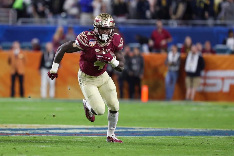 Dec 30, 2016; Miami Gardens, FL, USA; Florida State Seminoles running back Dalvin Cook (4) runs the ball in the first quarter against the Michigan Wolverines at Hard Rock Stadium. Mandatory Credit: Logan Bowles-USA TODAY Sports