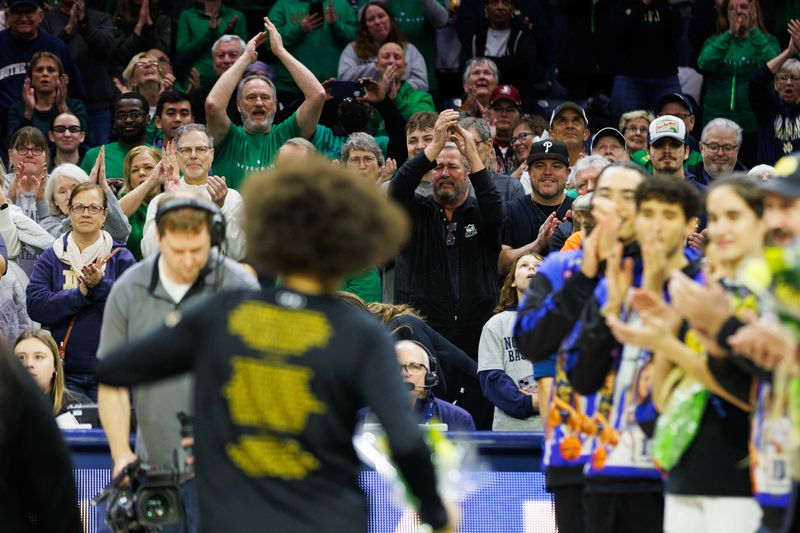 Fans stand and clap for Notre Dame guard Olivia Miles during a seniors night ceremony before a NCAA women's basketball game between No. 3 Notre Dame and No. 24 Florida State at Purcell Pavilion on Thursday, Feb. 27, 2025, in South Bend.