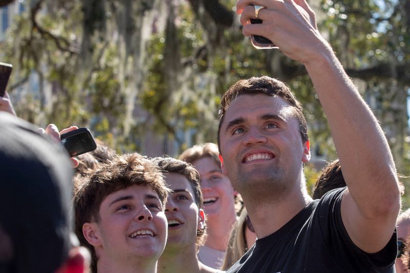 Charlie Kirk, conservative star and founder of Turning Point USA signs hats and takes photos with supporters after his visit to FSU for his 'American Comeback Tour' Friday, Feb. 28, 2025, as part
