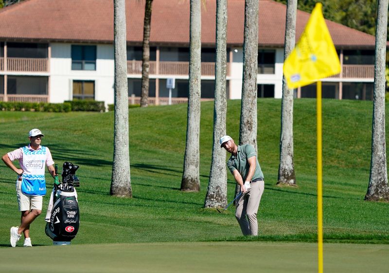 Chris Kirk hits a chip shot to the third green during the second round of the Cognizant Classic in the Palm Beaches at PGA National Resort & Spa on Friday, February 28, 2025, in Palm Beach Gardens, FL.
