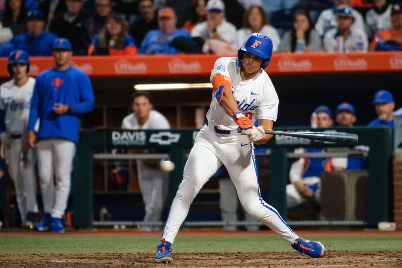Florida Gators Colby Shelton (10) swings at a ball during a game between the Florida Gators and the Miami Hurricanes at Condron Family Ballpark in Gainesville, FL on Friday, February 28, 2025. [Chris Watkins/Gainesville Sun]