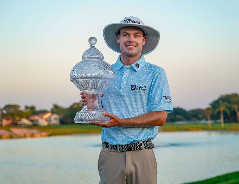 Joe Highsmith poses with the trophy after winning the Cognizant Classic in the Palm Beaches at PGA National Resort & Spa on Sunday, March 2, 2025, in Palm Beach Gardens, FL.