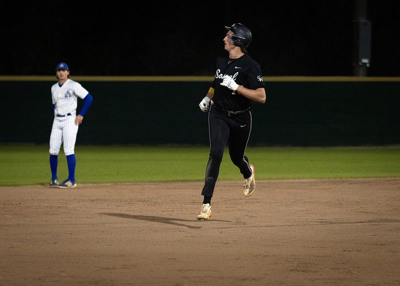 South Walton’s Coleman Borthwick watches his home run clear the center field monster in Panama City Beach, Fla., March 6, 2025. South Walton won the game 11-1. (Tyler Orsburn/News Herald)