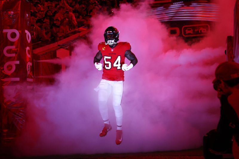 Oct 21, 2024; Tampa, Florida, USA;Tampa Bay Buccaneers linebacker Lavonte David (54) runs out of the tunnel before the game Baltimore Ravens at Raymond James Stadium. Mandatory Credit: Kim Klement Neitzel-Imagn Images