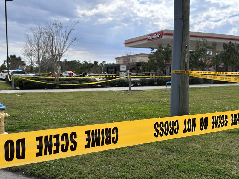 In this March 8, 2025, file photo, the RaceTrac at 3000 State Road 44 in New Smyrna Beach is blocked off with crime scene tape after a brawl between rival biker gangs escalated into a shooting. Mark Harper