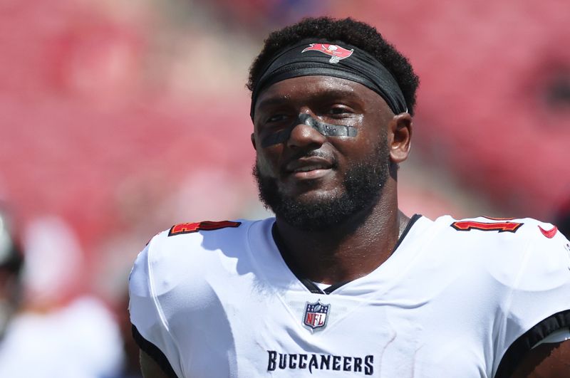Sep 22, 2024; Tampa, Florida, USA; Tampa Bay Buccaneers wide receiver Chris Godwin (14) works out prior to the game against the Denver Broncos at Raymond James Stadium. Mandatory Credit: Kim Klement Neitzel-Imagn Images