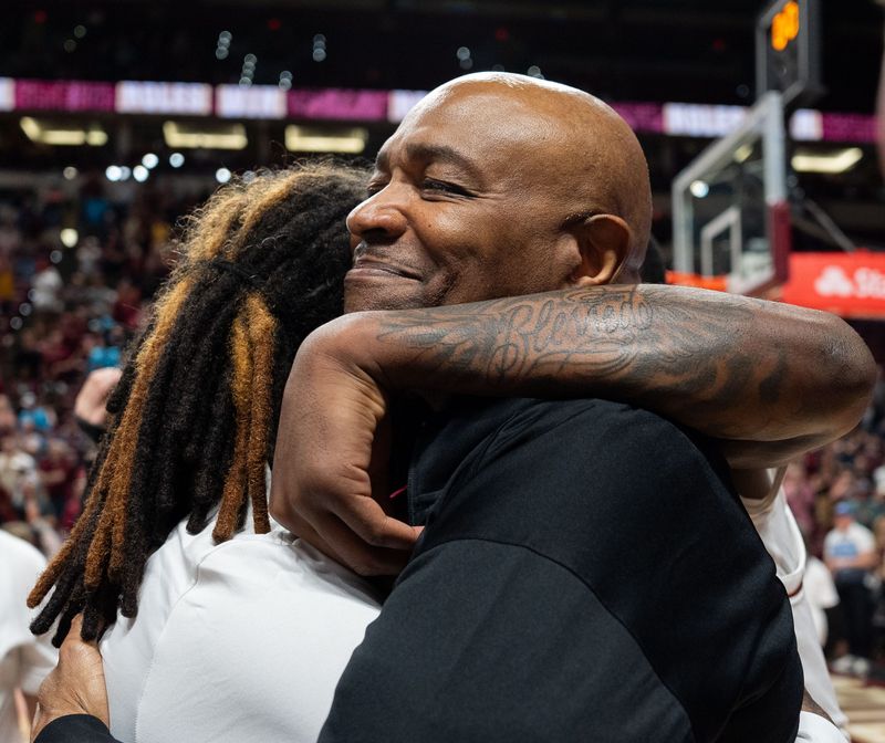 Florida State Seminoles head coach Leonard Hamilton hugs a player after winning his last home game as head coach and becoming the winningest coach in FSU history before retiring. The Florida State Seminoles defeated the Southern Methodist Mustangs 76-69 on Saturday, March 8, 2025.