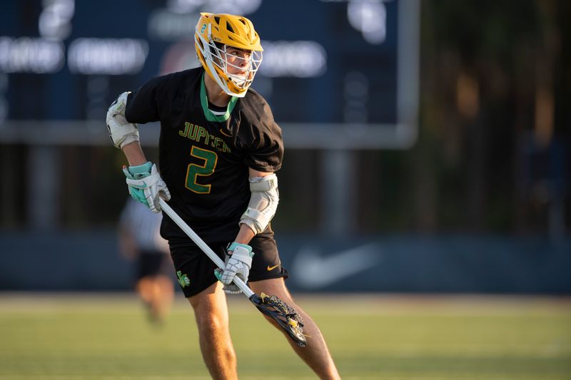 Jupiter's David Druhot places against Oxbridge Academy during their lacrosse match in West Palm Beach, Florida on March 13, 2025.