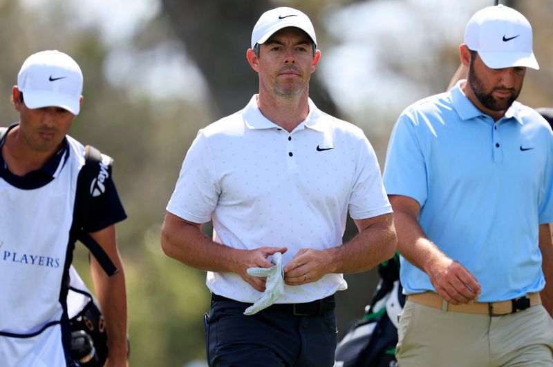 Rory McIlroy walks next to Scottie Scheffler on the ninth fairway during the second round of The Players Championship PGA golf tournment Friday, March 14, 2025 at TPC Sawgrass in Ponte Vedra Beach, Fla. [Corey Perrine/Florida Times-Union]